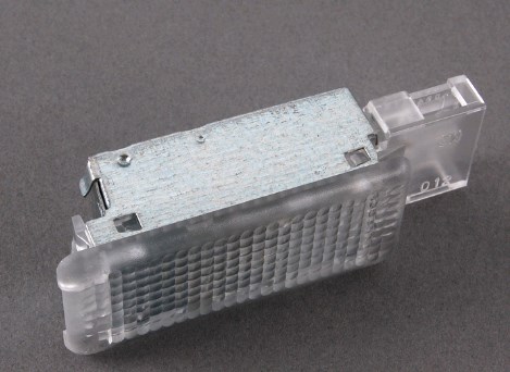 Quebra-luz da luz de fundo de porta-luvas 7L0947415 VAG