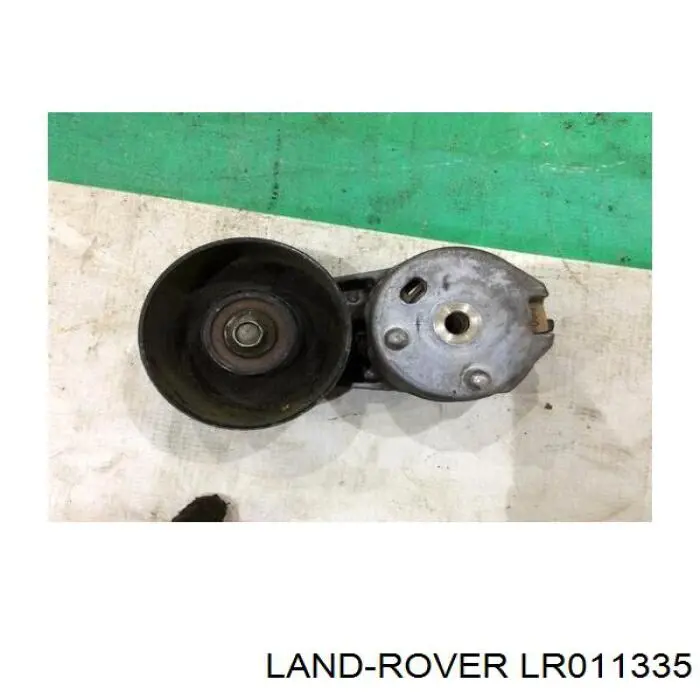 LR011335 Land Rover Reguladora de tensão da correia de transmissão