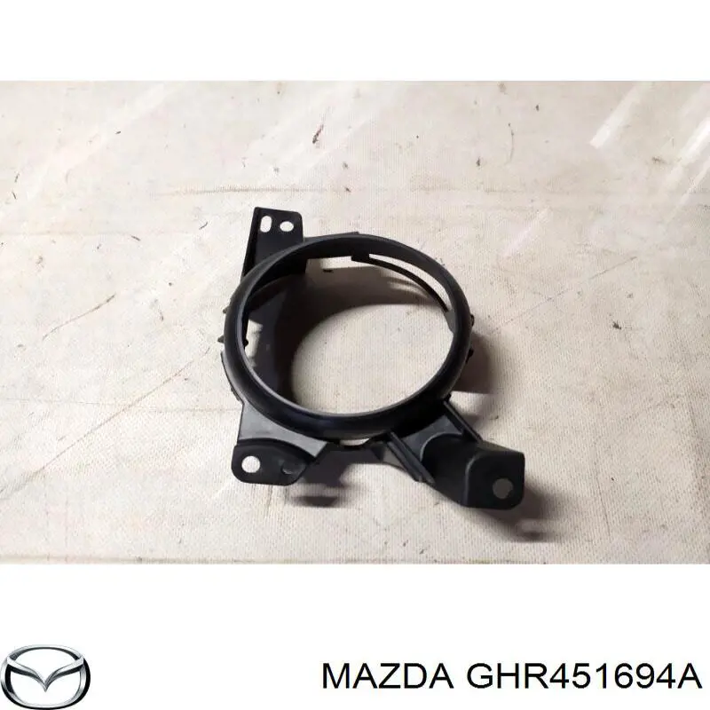 GHR451694A Mazda Consola de fixação das luzes de nevoeiro esquerdas