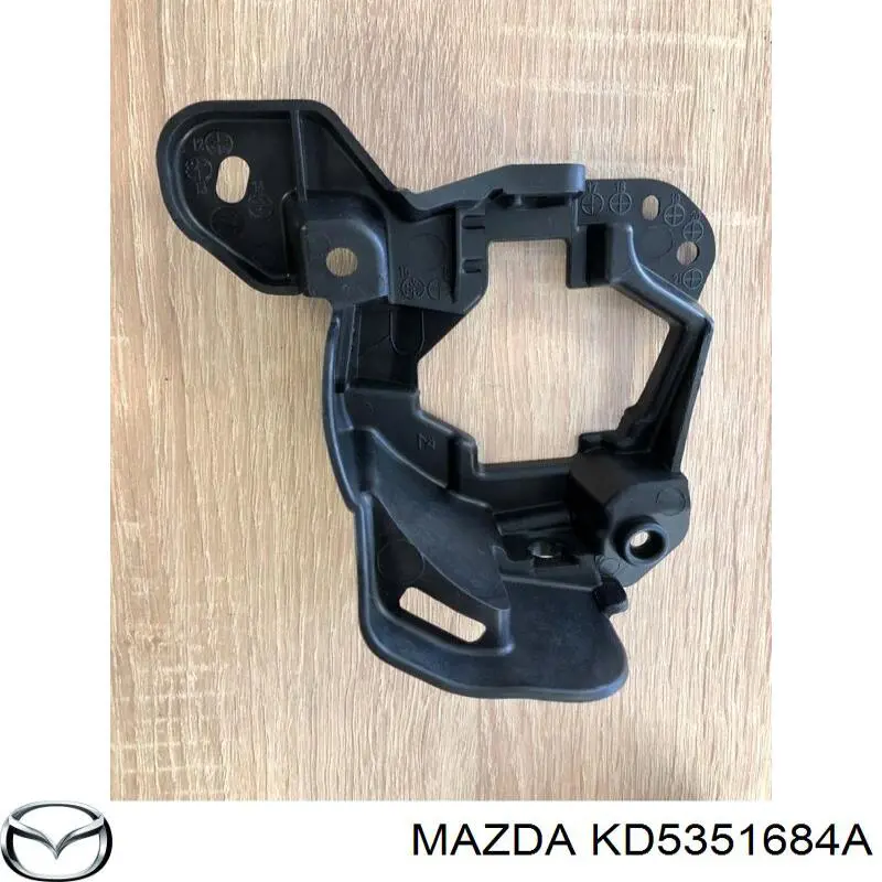 KD5351684A Mazda Consola de fixação das luzes de nevoeiro direitas