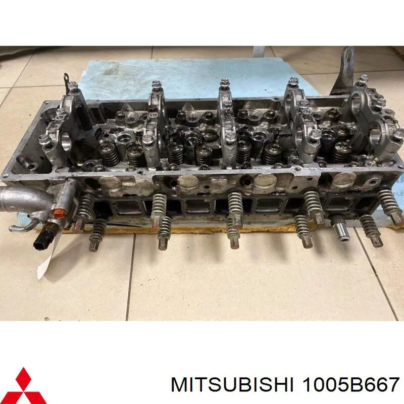 Compre 1005B667 Mitsubishi Cabeça de motor (CBC)