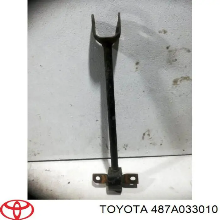 487A033010 Toyota Barra longitudinal de suspensão traseira esquerda