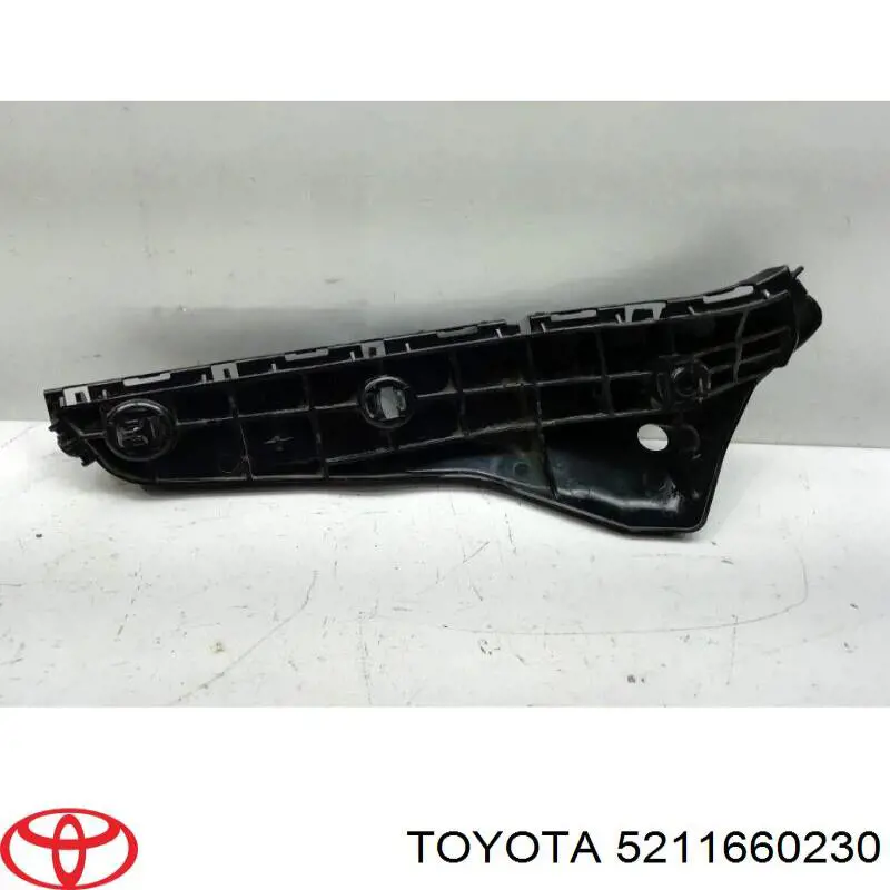 Consola externa esquerda do pára-choque dianteiro Toyota 5211660230