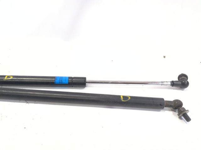 Amortecedor da capota esquerdo 57251AJ010 SUBARU