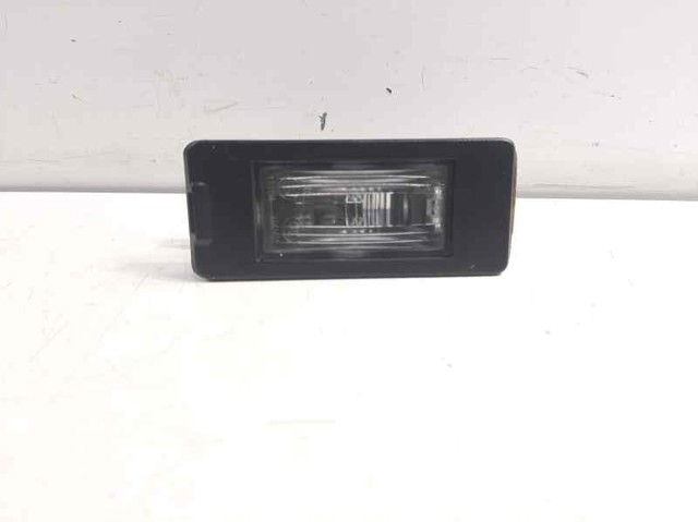 Lanterna da luz de fundo de matrícula traseira 13590043 OPEL
