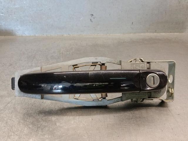 Suporte de maçaneta externa da porta dianteira esquerda 1T0837885B VAG