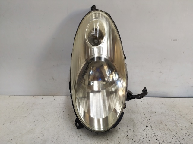 Luz esquerda 26060AX700 NISSAN