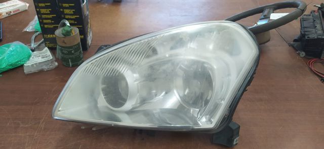 Luz esquerda 26060JD91B NISSAN