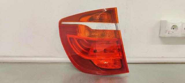 Lanterna traseira esquerda externa 7217311 BMW