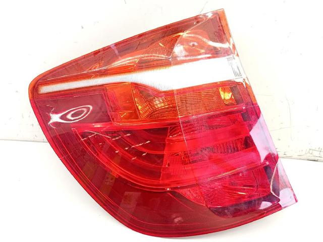 Lanterna traseira esquerda externa 7217311 BMW