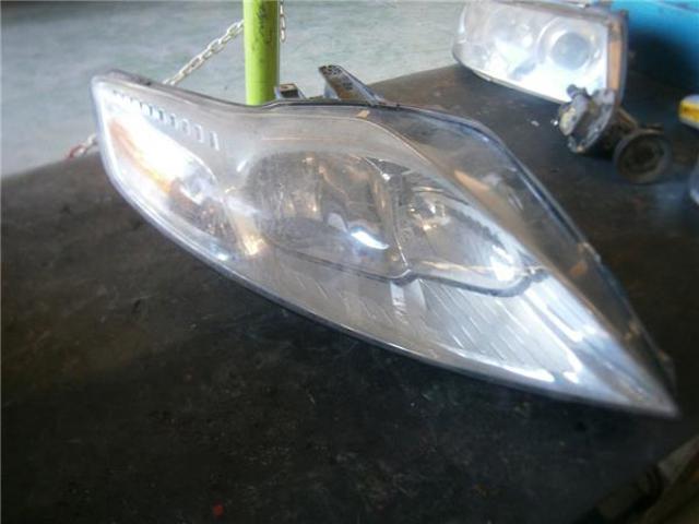 Luz direita 7S7113100AD FORD