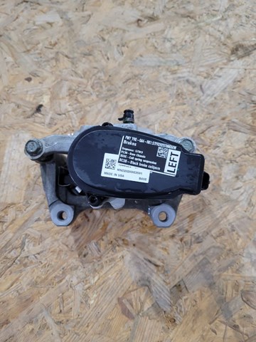 104462300H Tesla Suporte do freio traseiro esquerdo