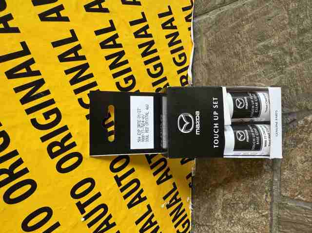 Tingimento (lápis) Mazda 9000777W246V preço, a partir de 30,08 USD