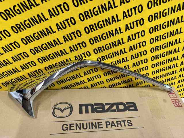 D10J507K0C Mazda Moldura esquerda do pára-choque dianteiro