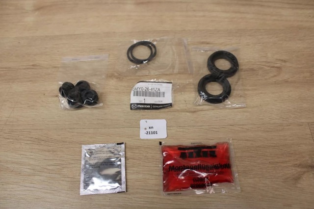 Kit de reparação de suporte do freio traseiro Mazda GMY02646ZA