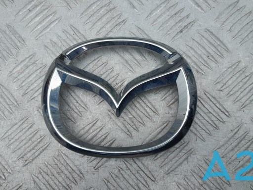 Emblema de grelha do radiador D10J51730 Mazda